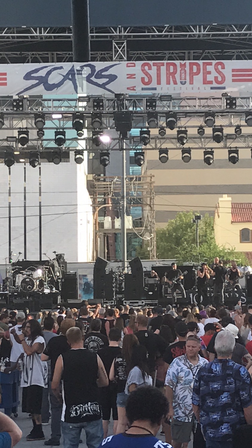 Festival crowd in front of a lit stage